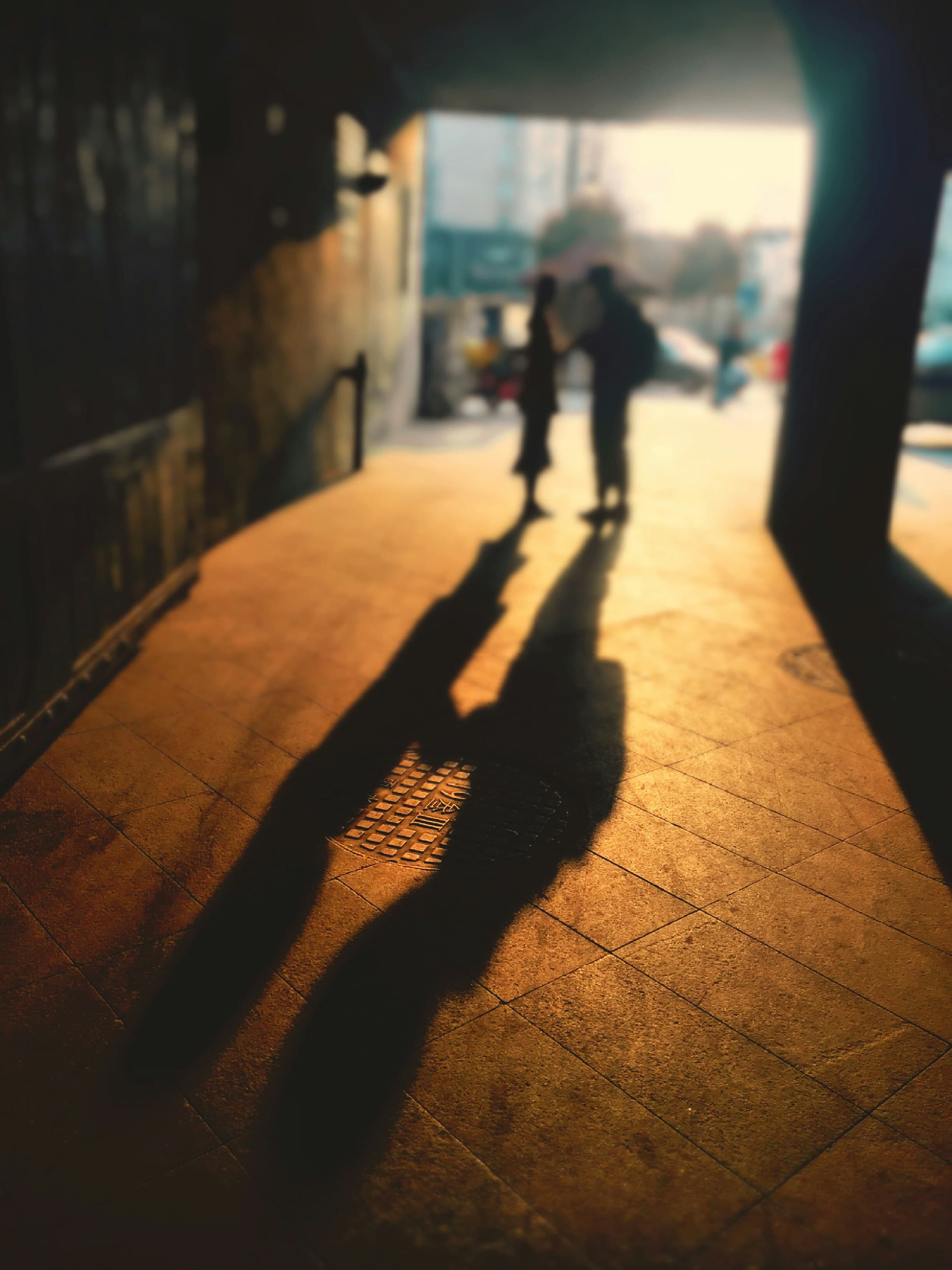 Two people in warm genuine conversation with soft golden light
